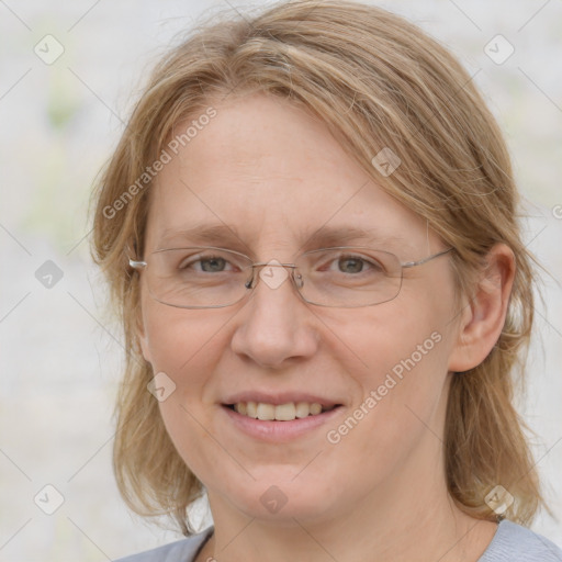 Joyful white adult female with medium  brown hair and blue eyes