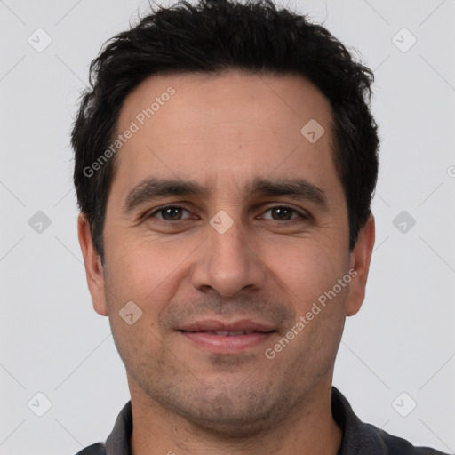 Joyful white young-adult male with short  black hair and brown eyes