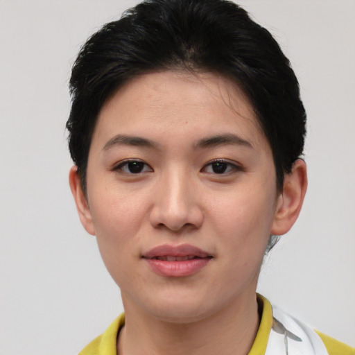 Joyful asian young-adult female with short  brown hair and brown eyes