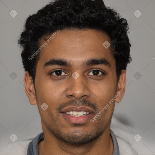 Joyful black young-adult male with short  black hair and brown eyes