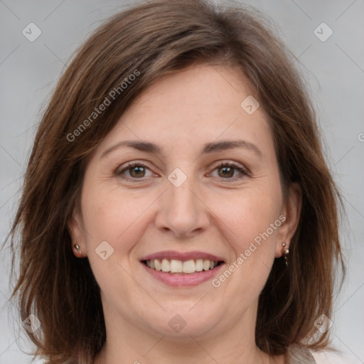 Joyful white adult female with medium  brown hair and grey eyes