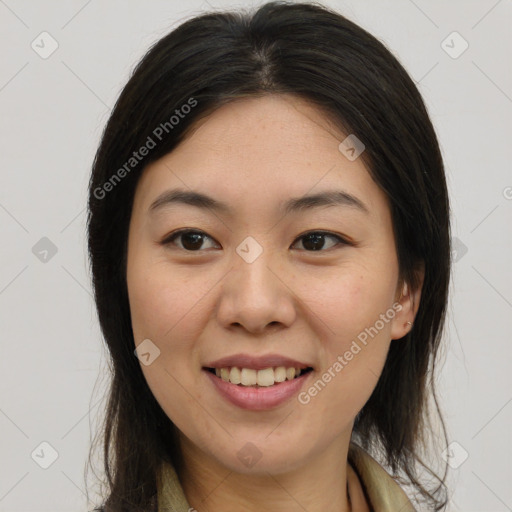 Joyful latino young-adult female with medium  brown hair and brown eyes