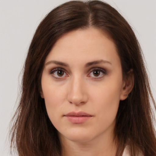 Neutral white young-adult female with long  brown hair and brown eyes