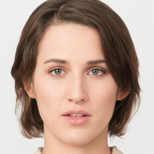 Neutral white young-adult female with medium  brown hair and green eyes