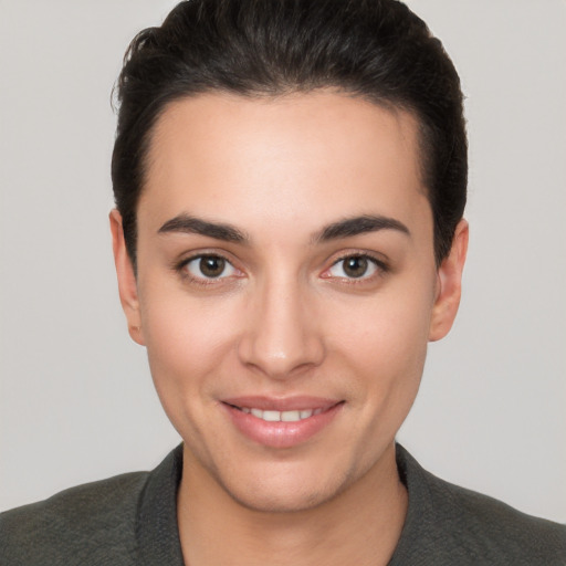 Joyful white young-adult female with short  brown hair and brown eyes