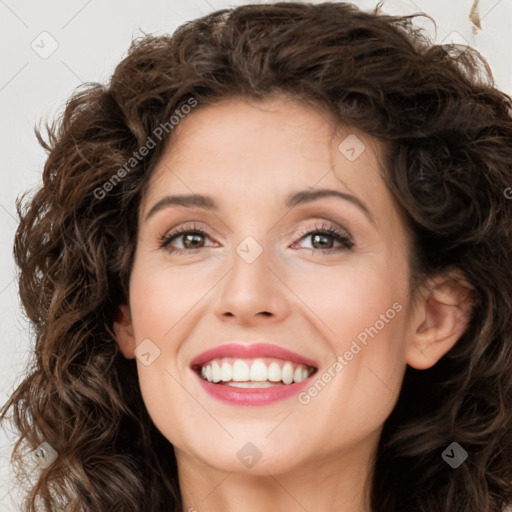 Joyful white young-adult female with long  brown hair and green eyes