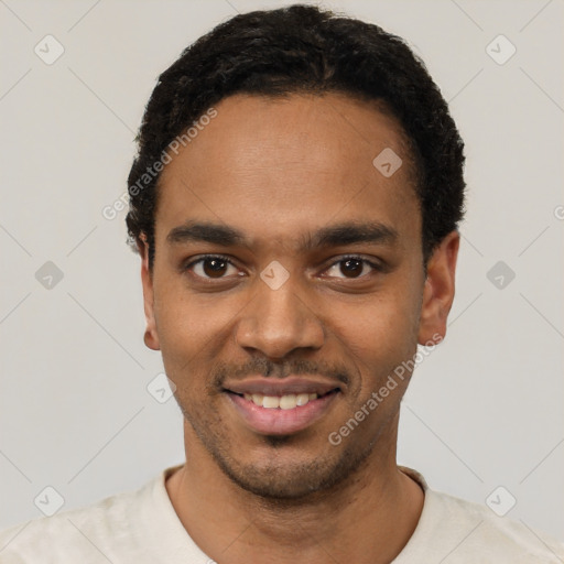 Joyful black young-adult male with short  black hair and brown eyes
