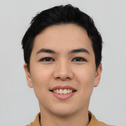 Joyful asian young-adult male with short  black hair and brown eyes