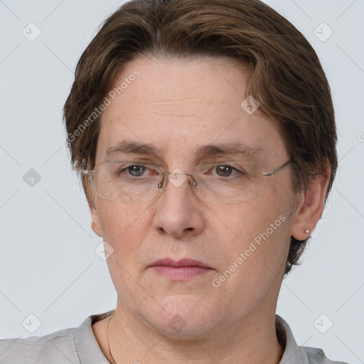 Joyful white adult female with short  brown hair and grey eyes