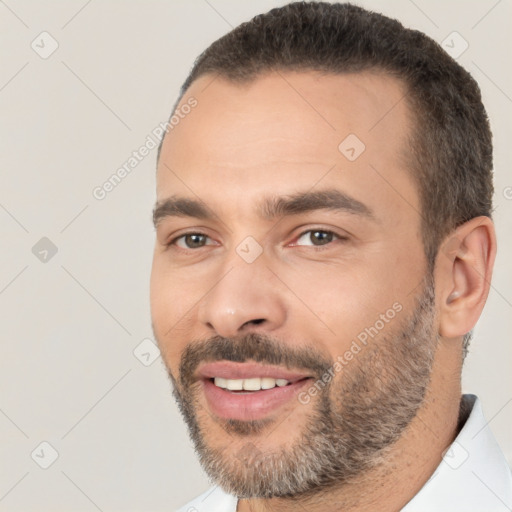 Joyful white young-adult male with short  black hair and brown eyes