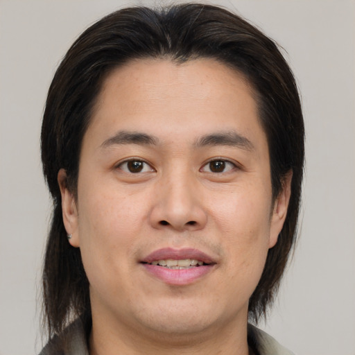 Joyful white young-adult male with medium  brown hair and brown eyes
