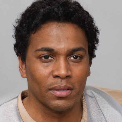 Neutral black young-adult male with short  brown hair and brown eyes