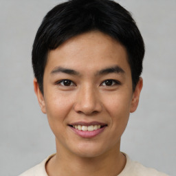 Joyful asian young-adult male with short  black hair and brown eyes