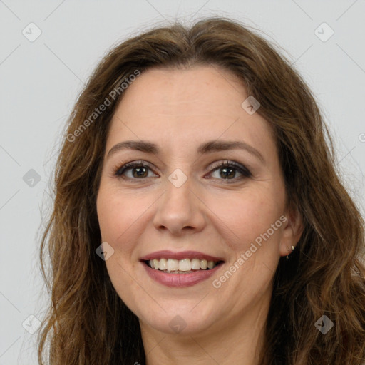 Joyful white adult female with long  brown hair and brown eyes