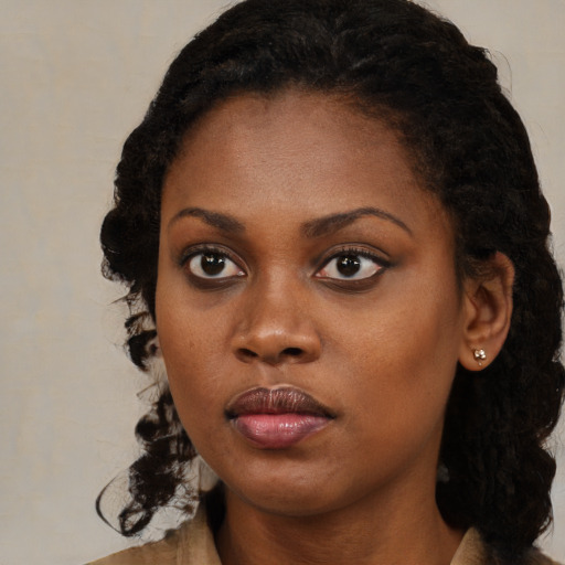 Neutral black young-adult female with long  black hair and brown eyes