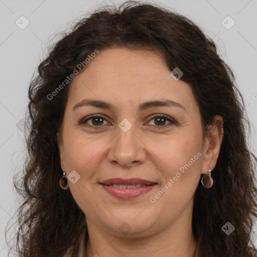 Joyful white adult female with long  brown hair and brown eyes