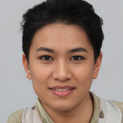 Joyful asian young-adult female with short  brown hair and brown eyes
