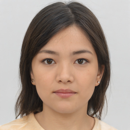 Neutral asian young-adult female with medium  brown hair and brown eyes