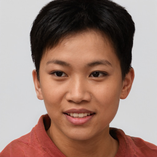 Joyful asian young-adult female with short  brown hair and brown eyes