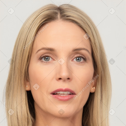 Joyful white adult female with long  brown hair and grey eyes