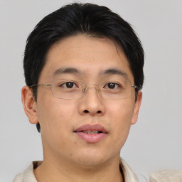 Neutral asian adult male with short  brown hair and brown eyes