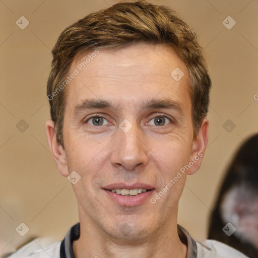 Joyful white adult male with short  brown hair and brown eyes