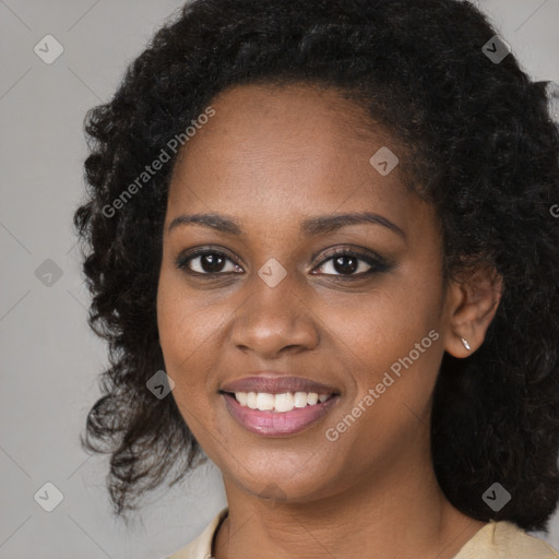 Joyful black young-adult female with medium  black hair and brown eyes