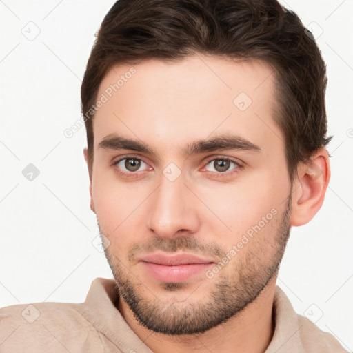 Neutral white young-adult male with short  brown hair and brown eyes