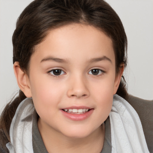 Joyful white child female with medium  brown hair and brown eyes