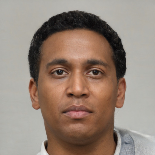 Neutral black young-adult male with short  black hair and brown eyes