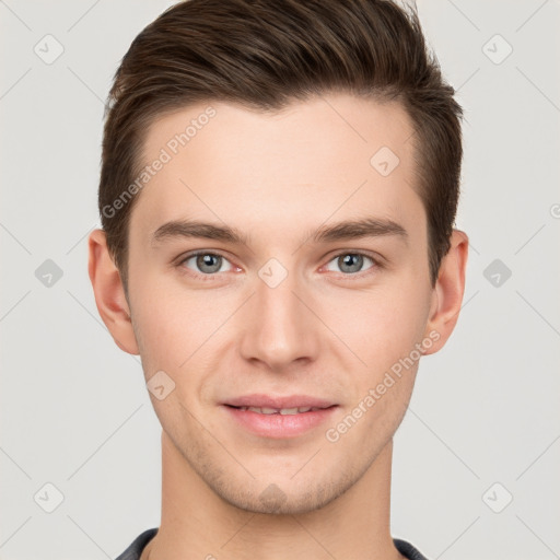 Joyful white young-adult male with short  brown hair and grey eyes