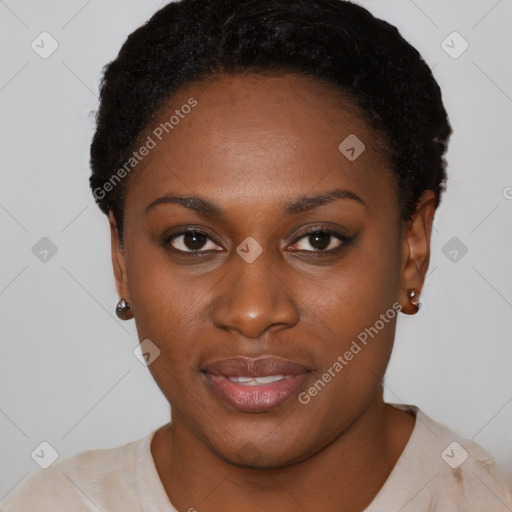 Joyful black young-adult female with short  black hair and brown eyes