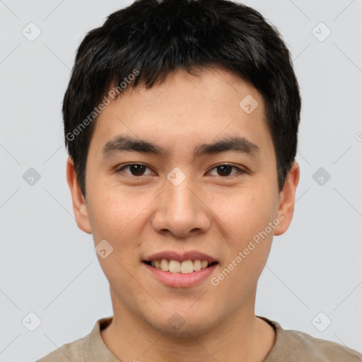 Joyful asian young-adult male with short  brown hair and brown eyes