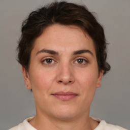 Joyful white adult female with short  brown hair and brown eyes