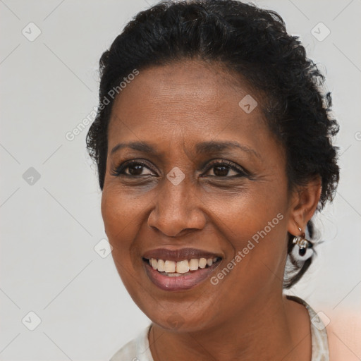 Joyful black adult female with short  brown hair and brown eyes