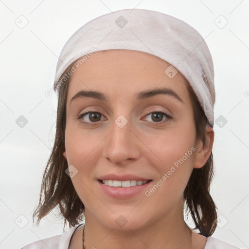 Joyful white young-adult female with medium  brown hair and grey eyes