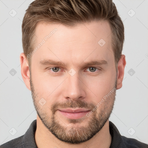 Joyful white young-adult male with short  brown hair and grey eyes