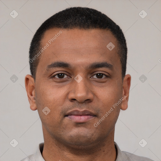 Neutral latino young-adult male with short  black hair and brown eyes