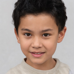 Joyful white child male with short  brown hair and brown eyes