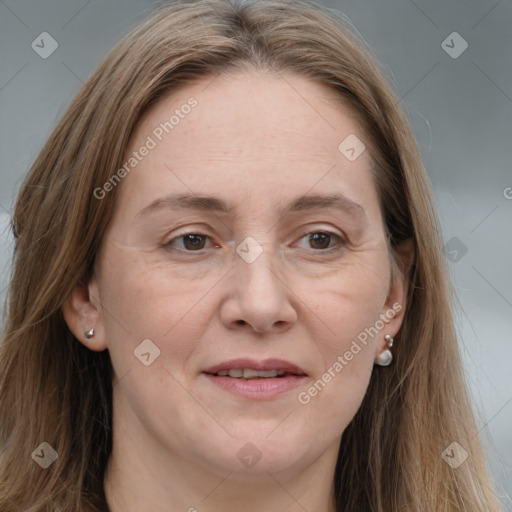 Joyful white adult female with long  brown hair and grey eyes