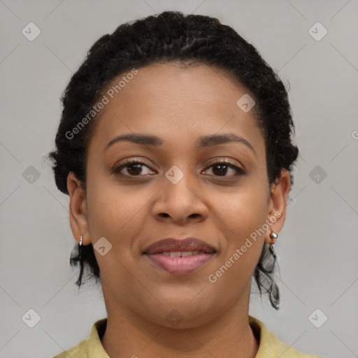 Joyful black young-adult female with short  brown hair and brown eyes