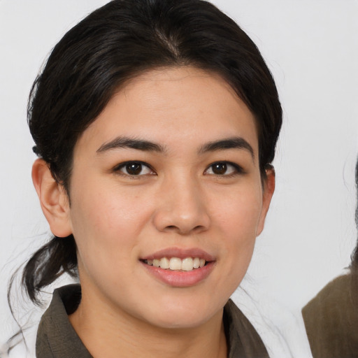 Joyful white young-adult female with medium  brown hair and brown eyes