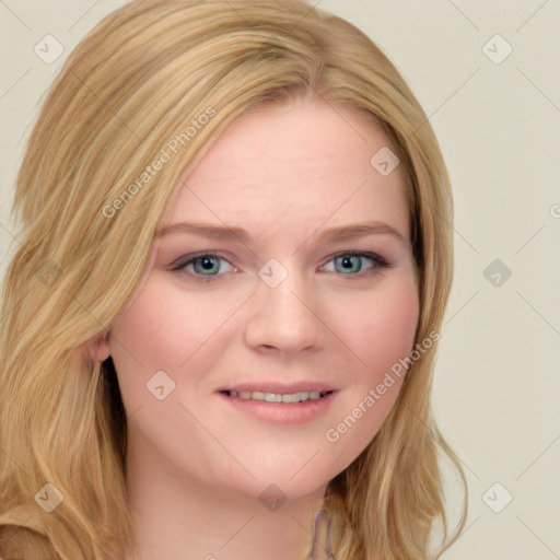 Joyful white young-adult female with long  blond hair and blue eyes