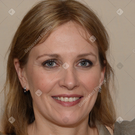 Joyful white adult female with medium  brown hair and grey eyes