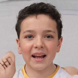 Joyful white child male with short  brown hair and brown eyes