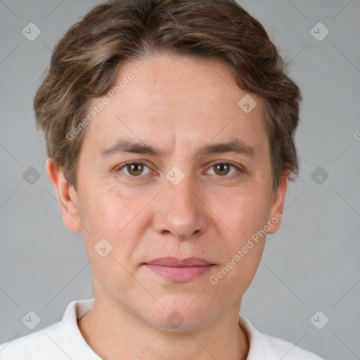 Joyful white adult male with short  brown hair and grey eyes