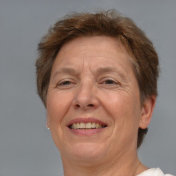 Joyful white middle-aged female with short  brown hair and brown eyes