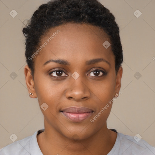 Joyful black young-adult female with short  black hair and brown eyes