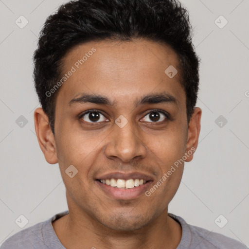 Joyful latino young-adult male with short  brown hair and brown eyes