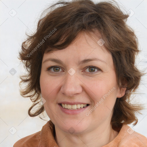 Joyful white adult female with medium  brown hair and blue eyes